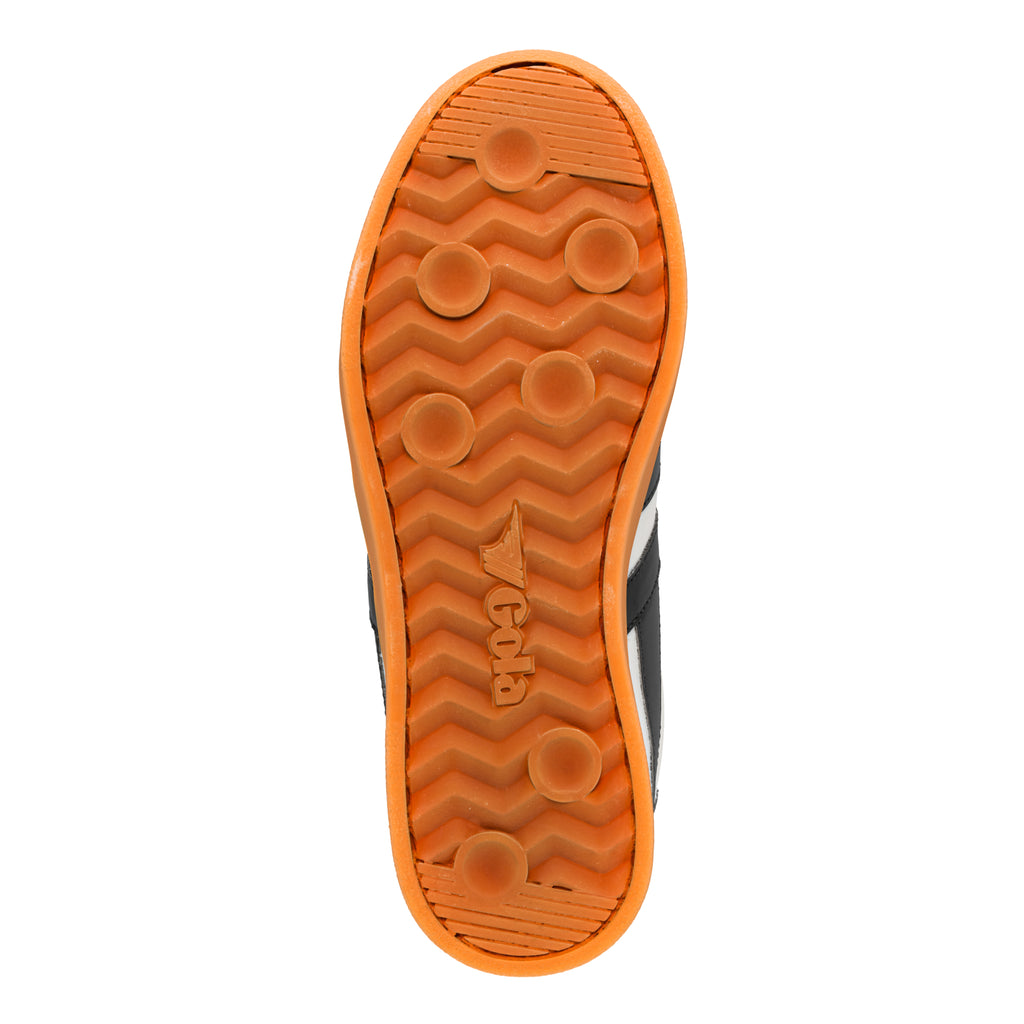 Orange rubber trainer sole with circular grip pattern and Gola branding