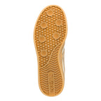 Tan rubber trainer sole with circular tread pattern and Gola branding