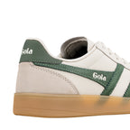 Close up of white and green Gola trainer with gum sole