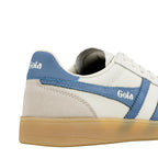 Close up of the heel and side panel of a white and blue Gola trainer with a gum sole