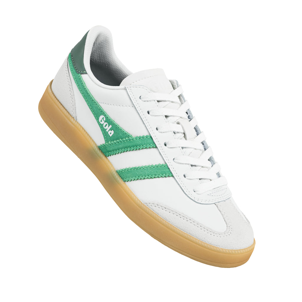 White Gola trainer with green side stripes and a gum rubber sole