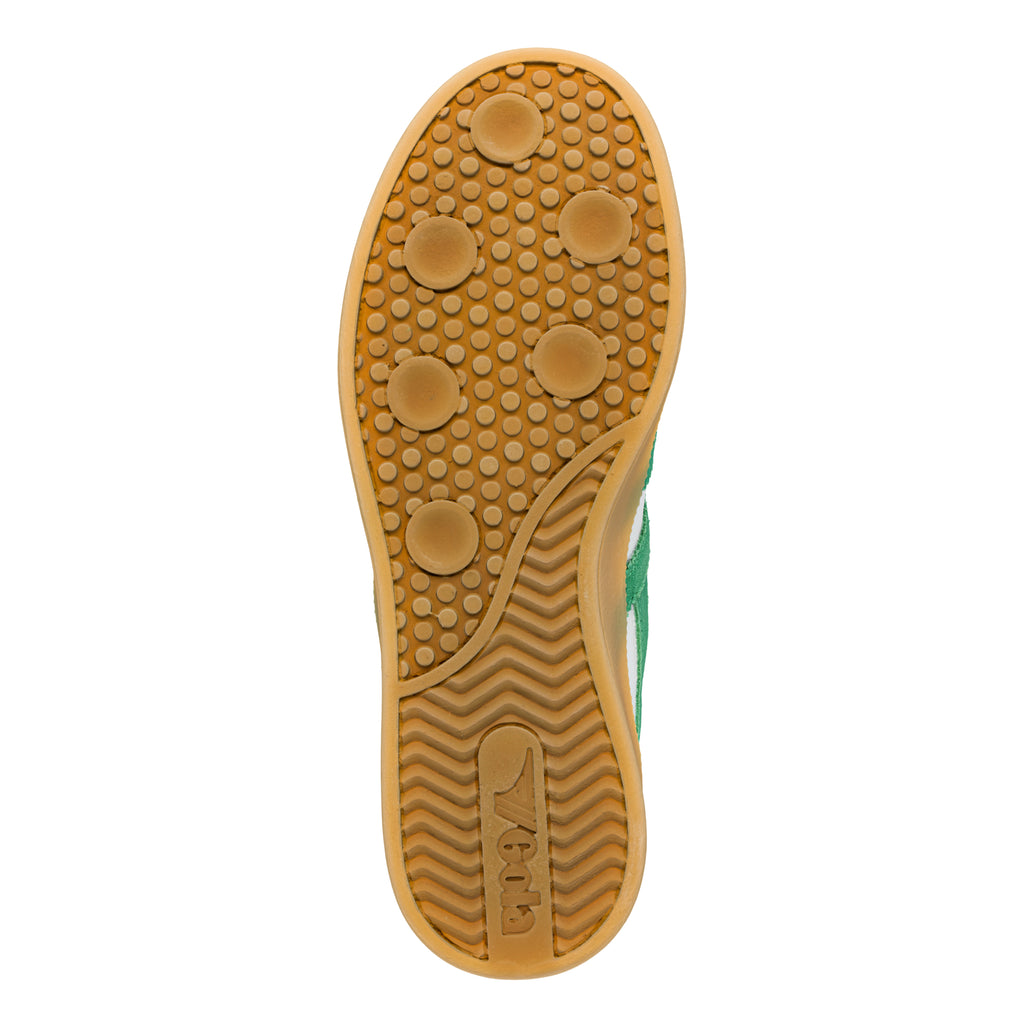 Gum rubber trainer sole with circular tread pattern and Gola branding