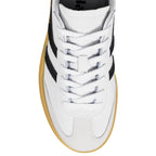 White leather trainer with black side stripes and gum sole