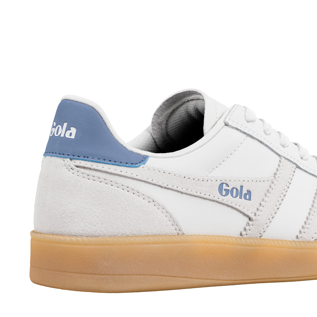 Close up of white Gola trainer with blue heel tab and gum sole