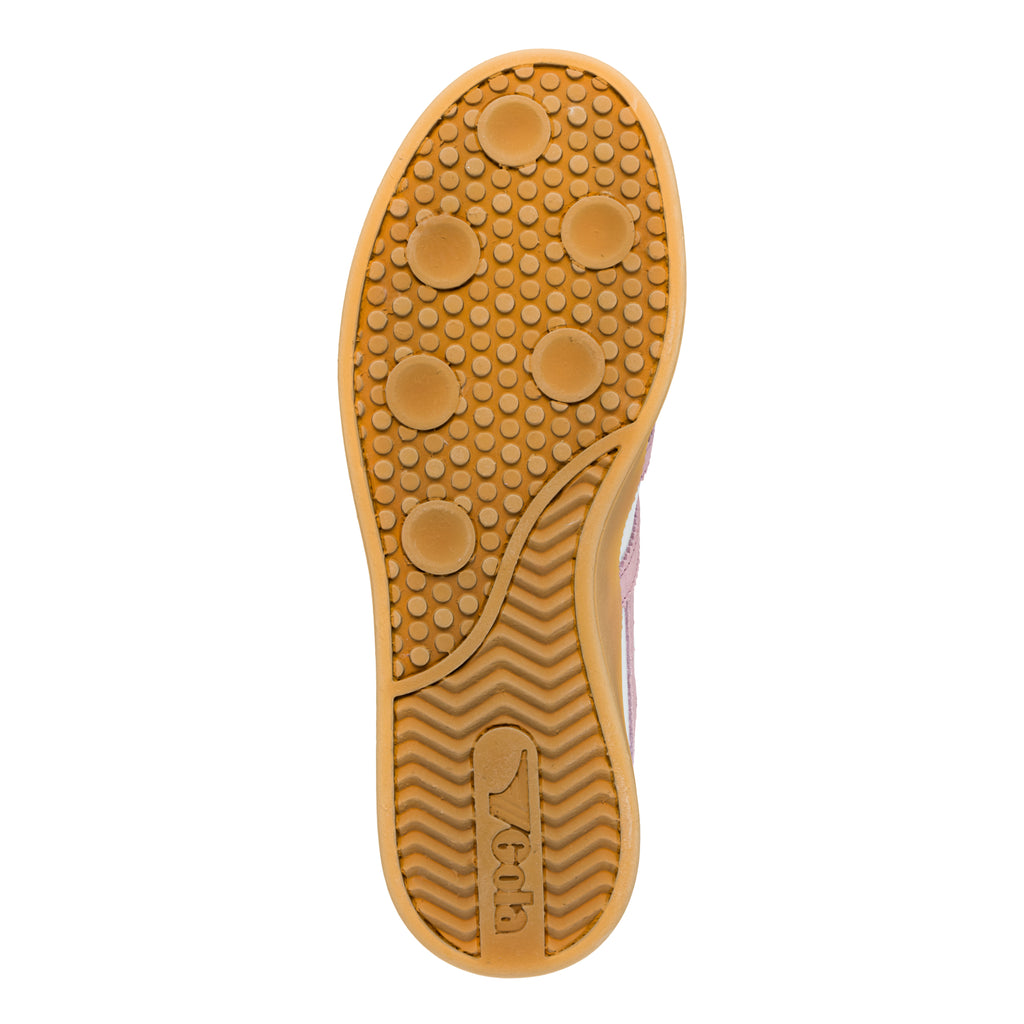 Tan rubber trainer sole with circular grip pattern and chevron tread