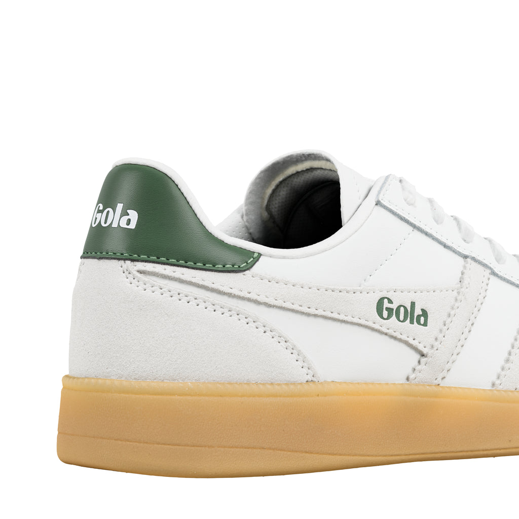 White leather trainer with green heel tab and gum sole