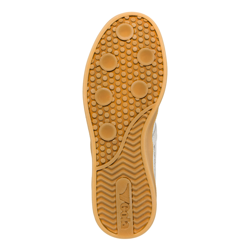 Tan rubber trainer sole with circular tread pattern and Gola logo