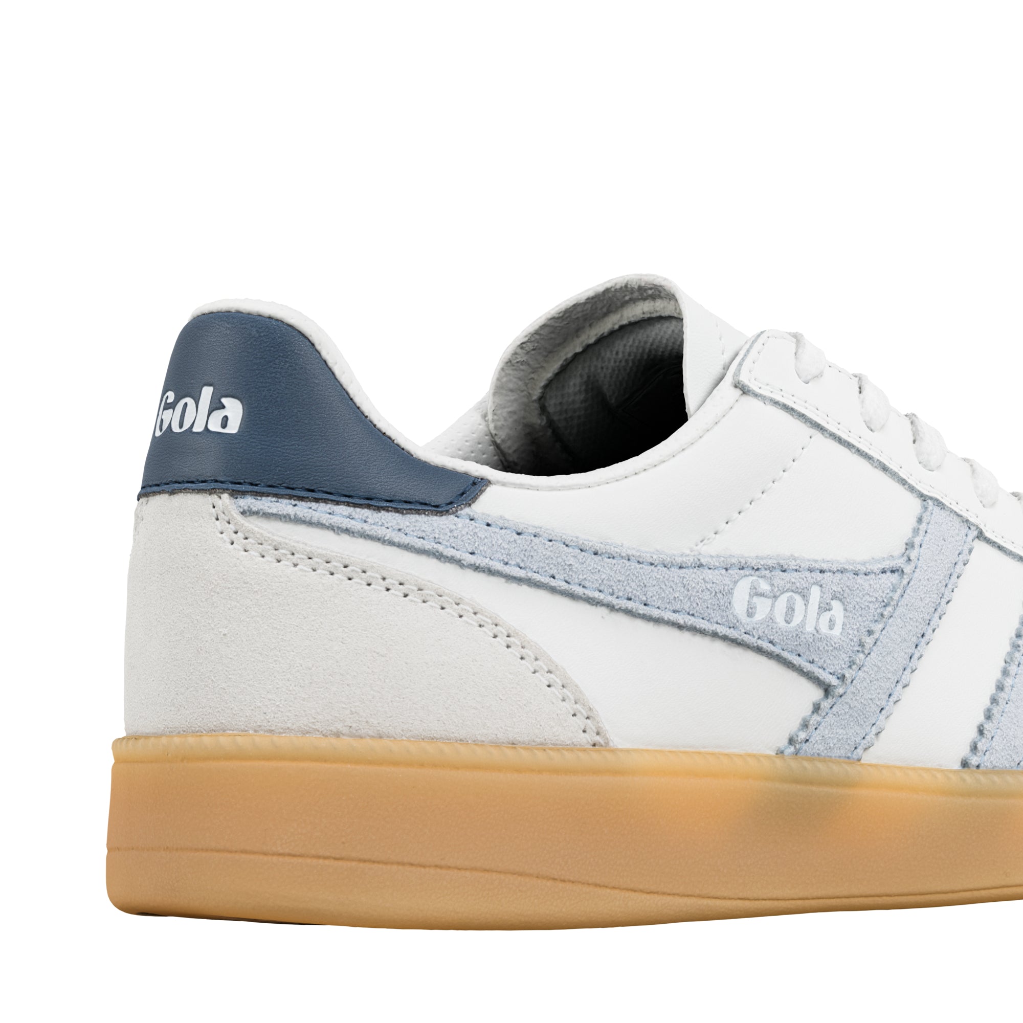 Close up of white Gola trainer heel with blue suede detailing and gum rubber sole