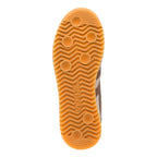 Gum rubber trainer sole with wavy tread pattern and circular grip points