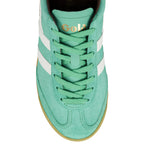 Top view of a mint green suede Gola trainer with white side stripes and a gum sole