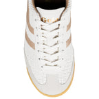 Top view of a white Gola trainer with metallic gold detailing and a gum sole