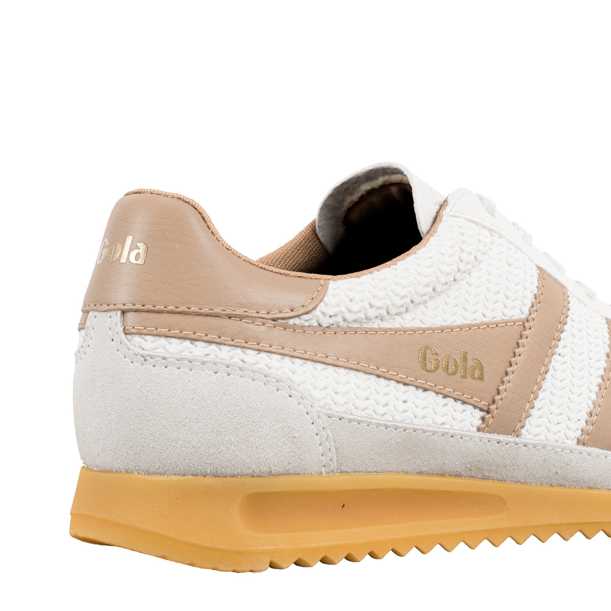 Close up of white and beige Gola trainer with gum sole