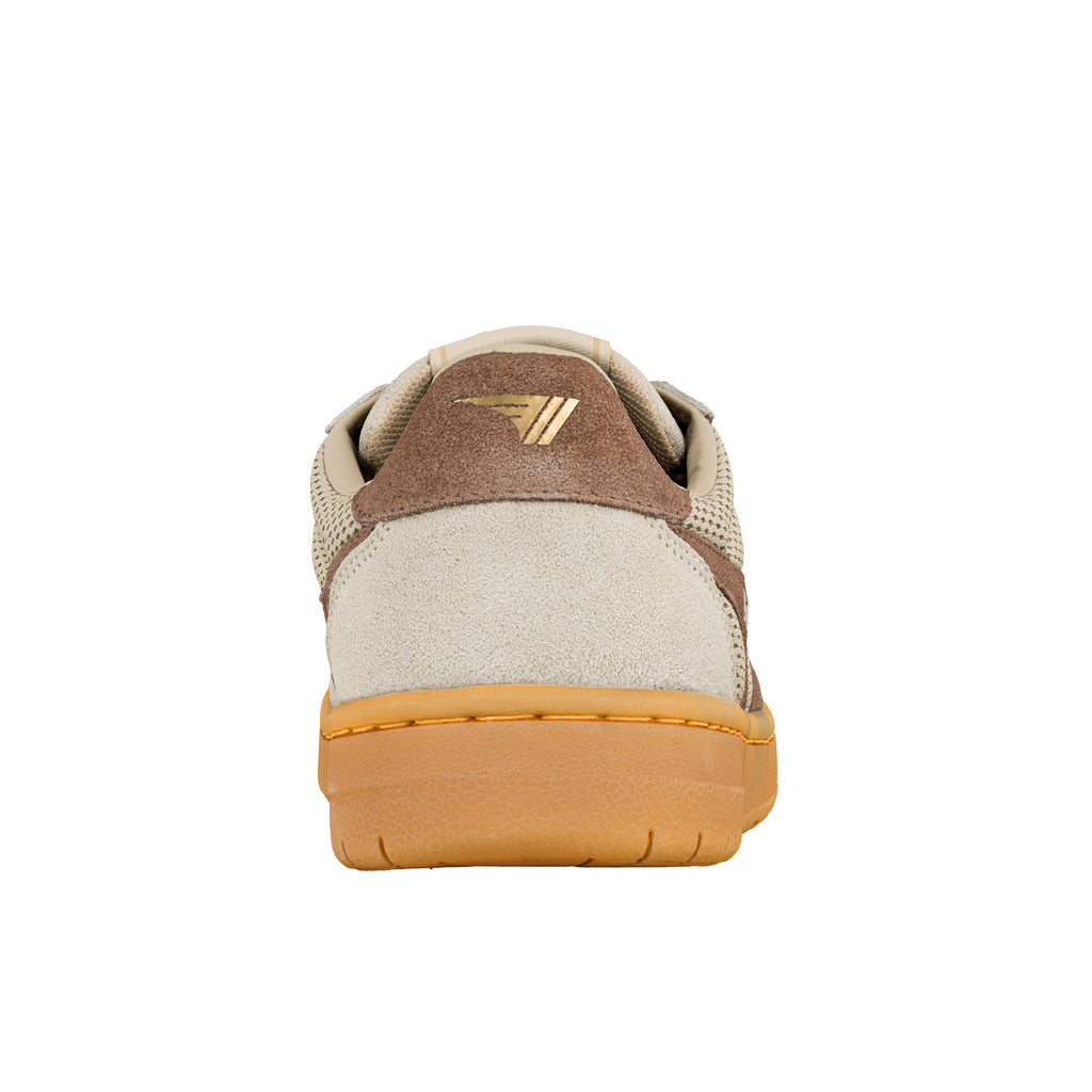 Rear view of a beige and brown suede trainer with a gum rubber sole