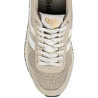 Top view of a beige Gola trainer with white laces and mesh detailing