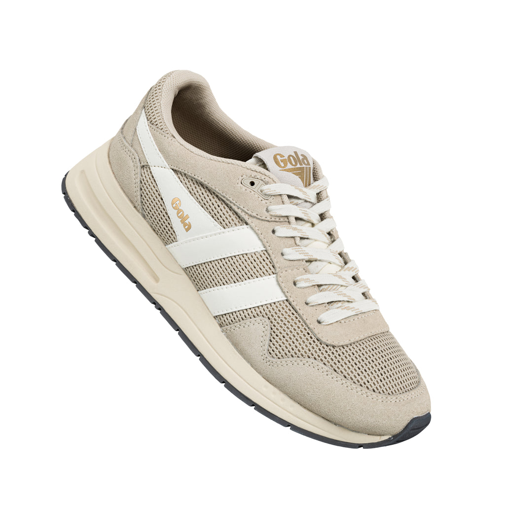 Beige Gola trainer with white side stripes and lace up fastening