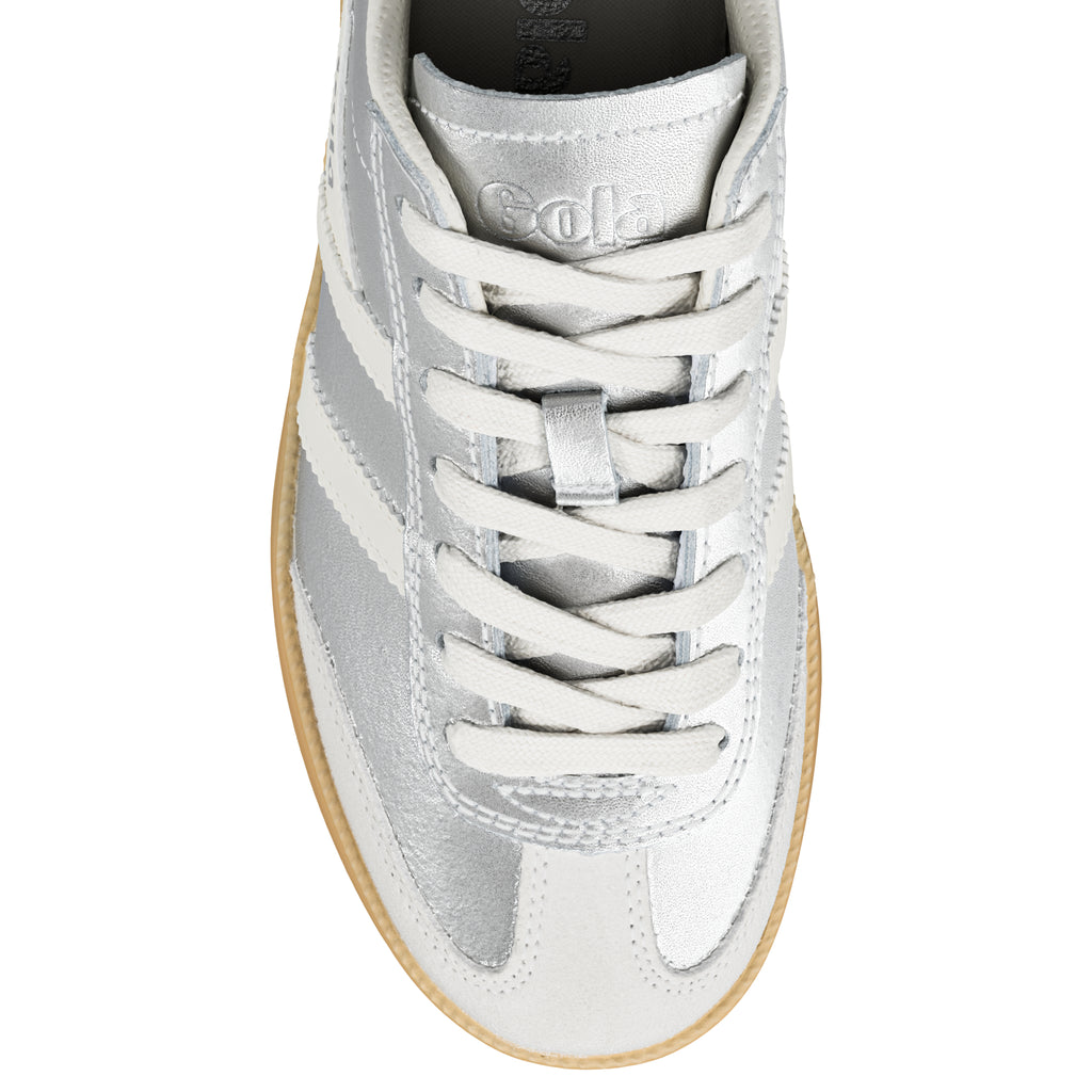 Top view of a silver metallic Gola trainer with white laces and a gum sole