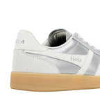 Close up of silver and white Gola trainer with gum sole