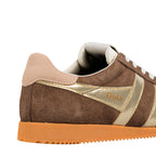 Close up of brown suede Gola trainer with gold side panels and orange sole