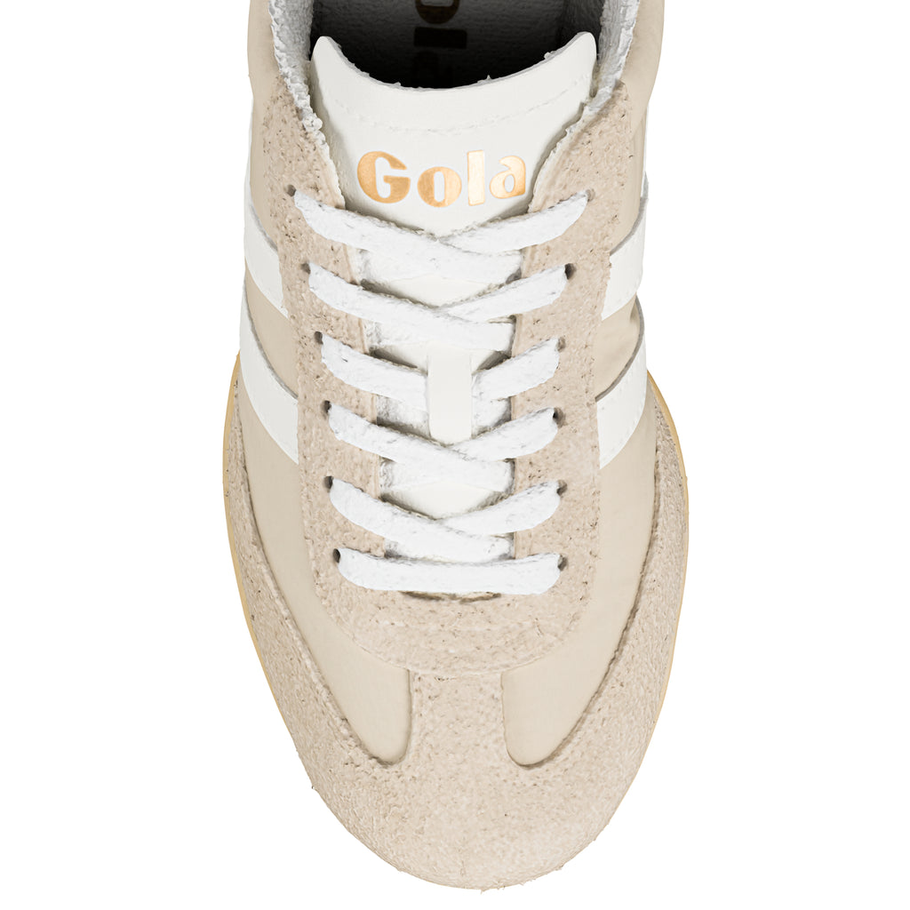 Close-up of a Gola trainer in beige with white laces and side stripes