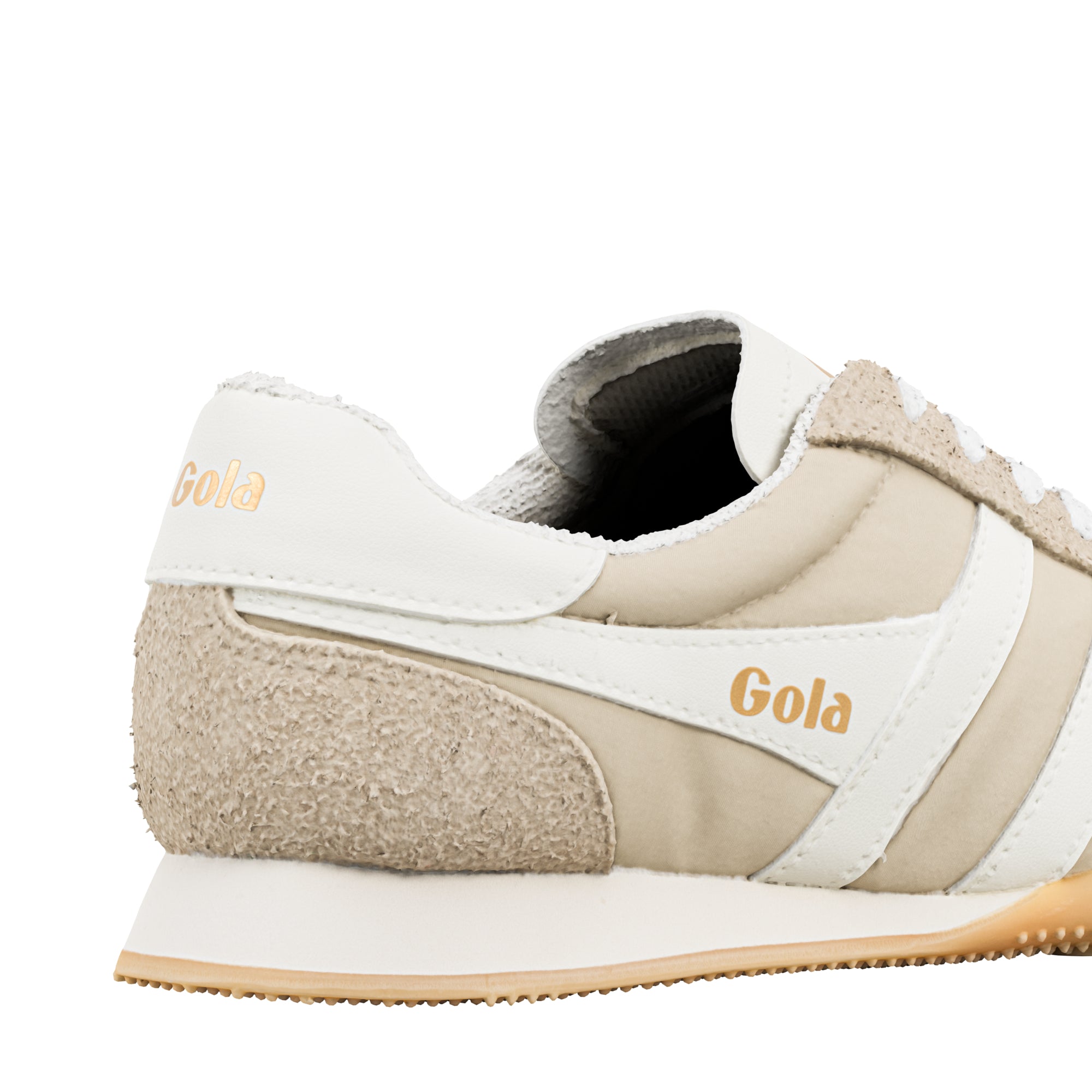Close up of the heel and side of a Gola trainer in beige and white