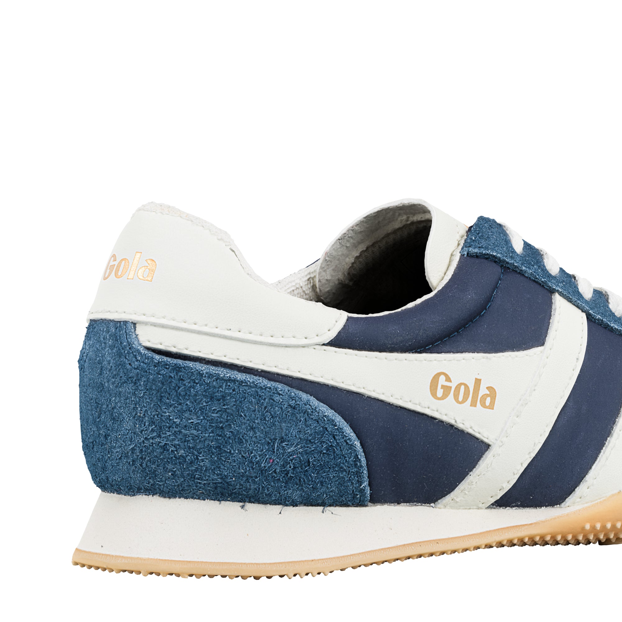 Rear side view of a navy blue and white Gola trainer with suede detailing and gum sole