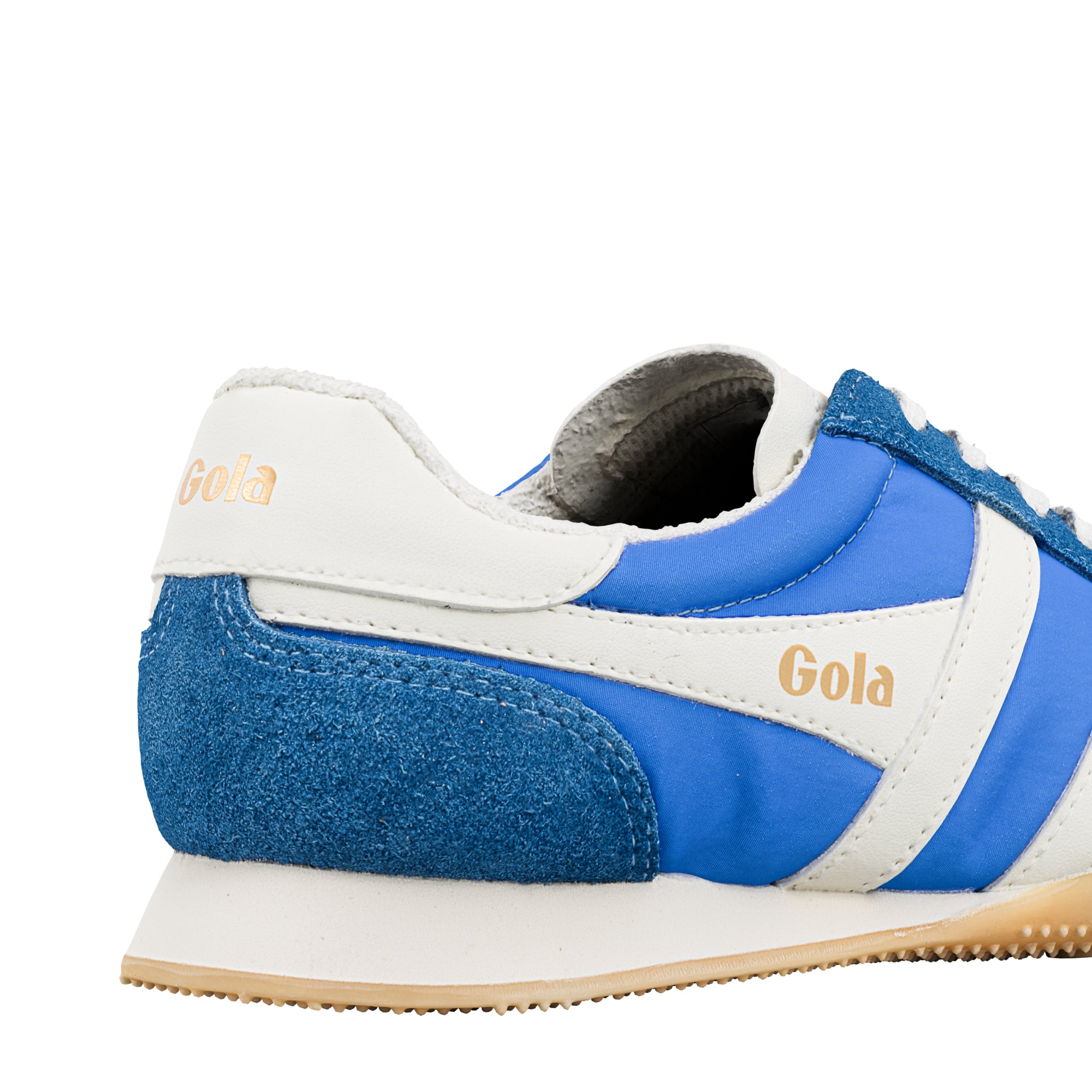 Close up of the heel of a Gola trainer in blue and white with a gum sole
