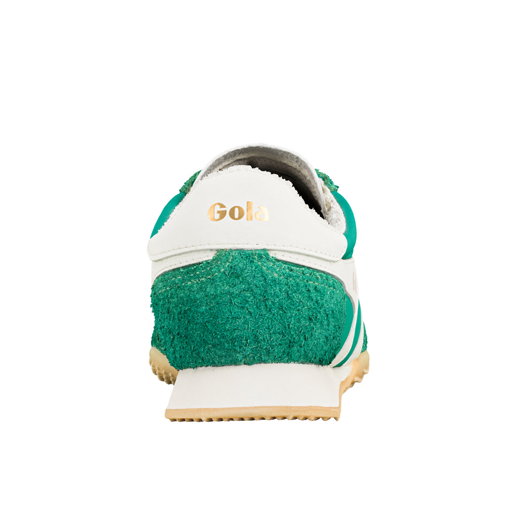 Rear view of a green and white Gola trainer with a gold Gola logo on the heel