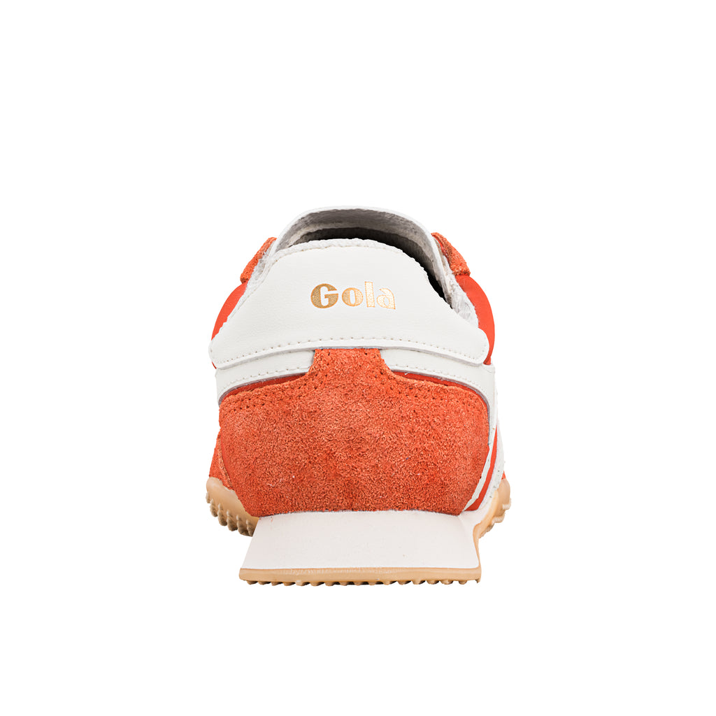 Rear view of an orange and white Gola trainer with a gum sole