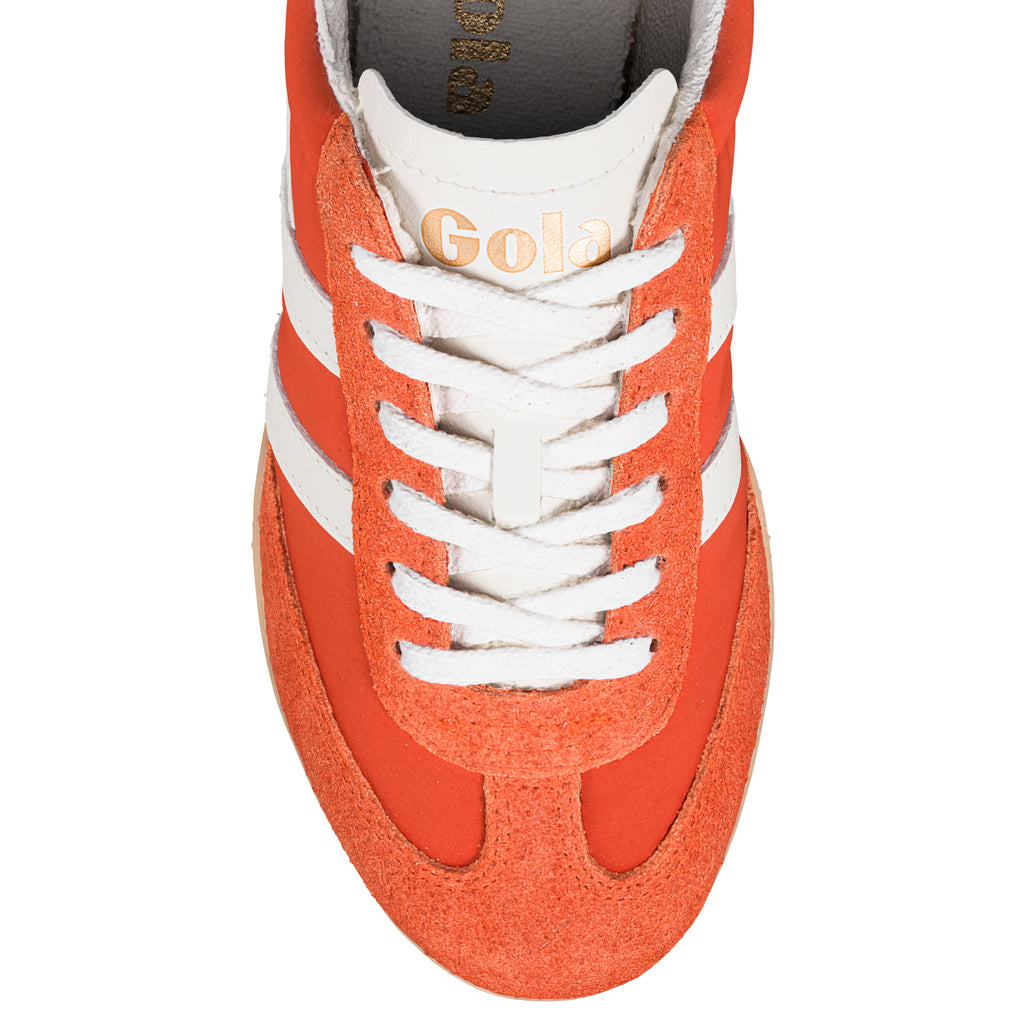 Top view of an orange and white Gola trainer with white laces