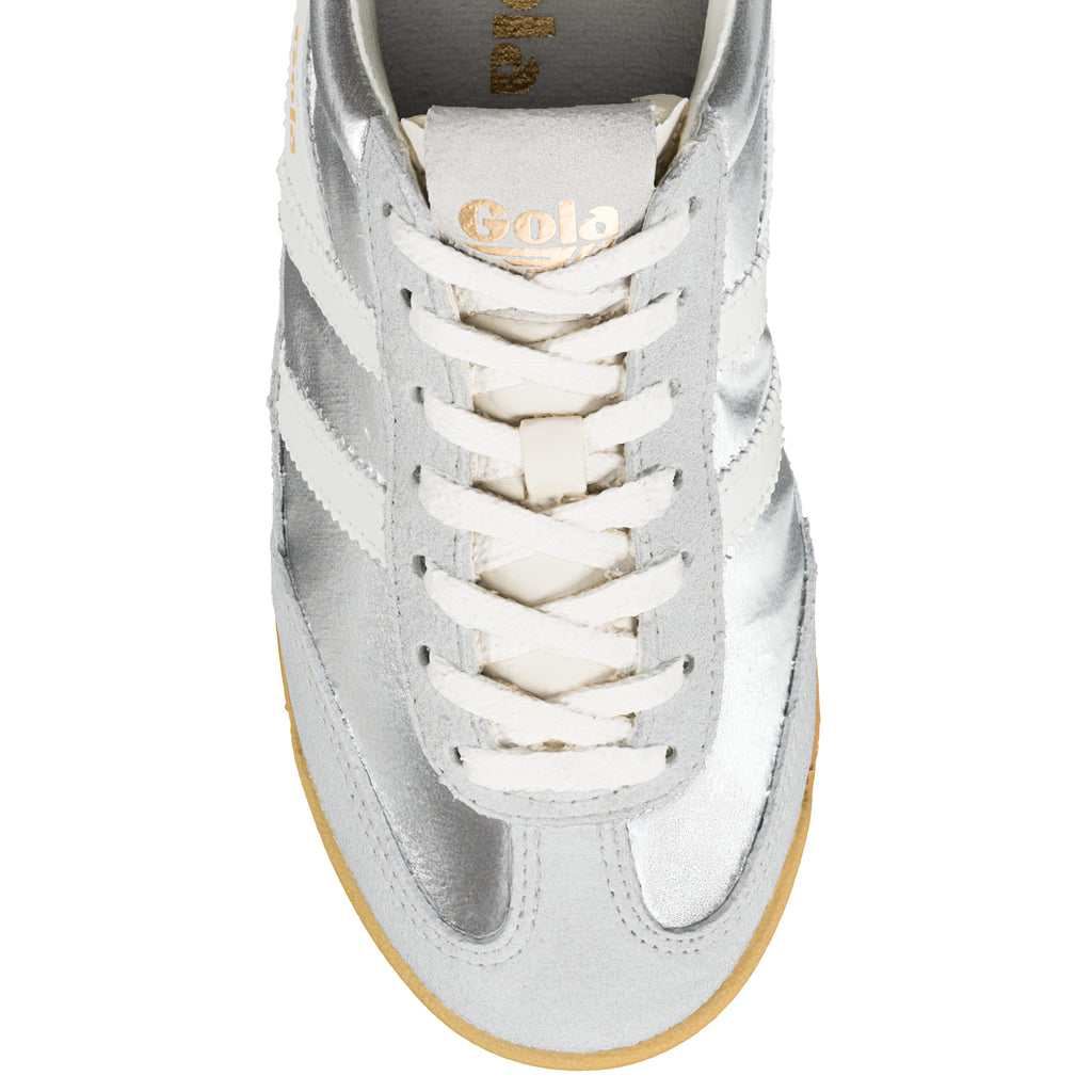 Close-up of a silver Gola trainer with white laces and stripes