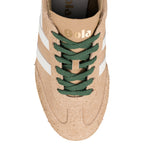 Top view of a beige suede Gola trainer with green laces and white side stripes