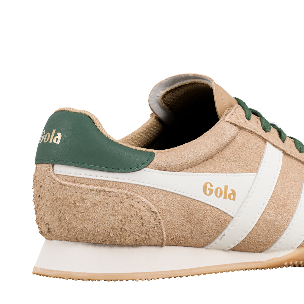 Close up of beige suede Gola trainer with green heel tab and white side stripe
