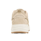 Rear view of a beige suede and mesh trainer with a white rubber sole