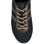 Black suede trainer with beige laces and snake print side stripes