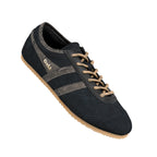 Black suede Gola trainer with textured side stripes and beige laces on a gum sole
