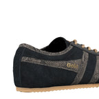 Close up of a black suede Gola trainer with snakeskin effect detailing and beige laces