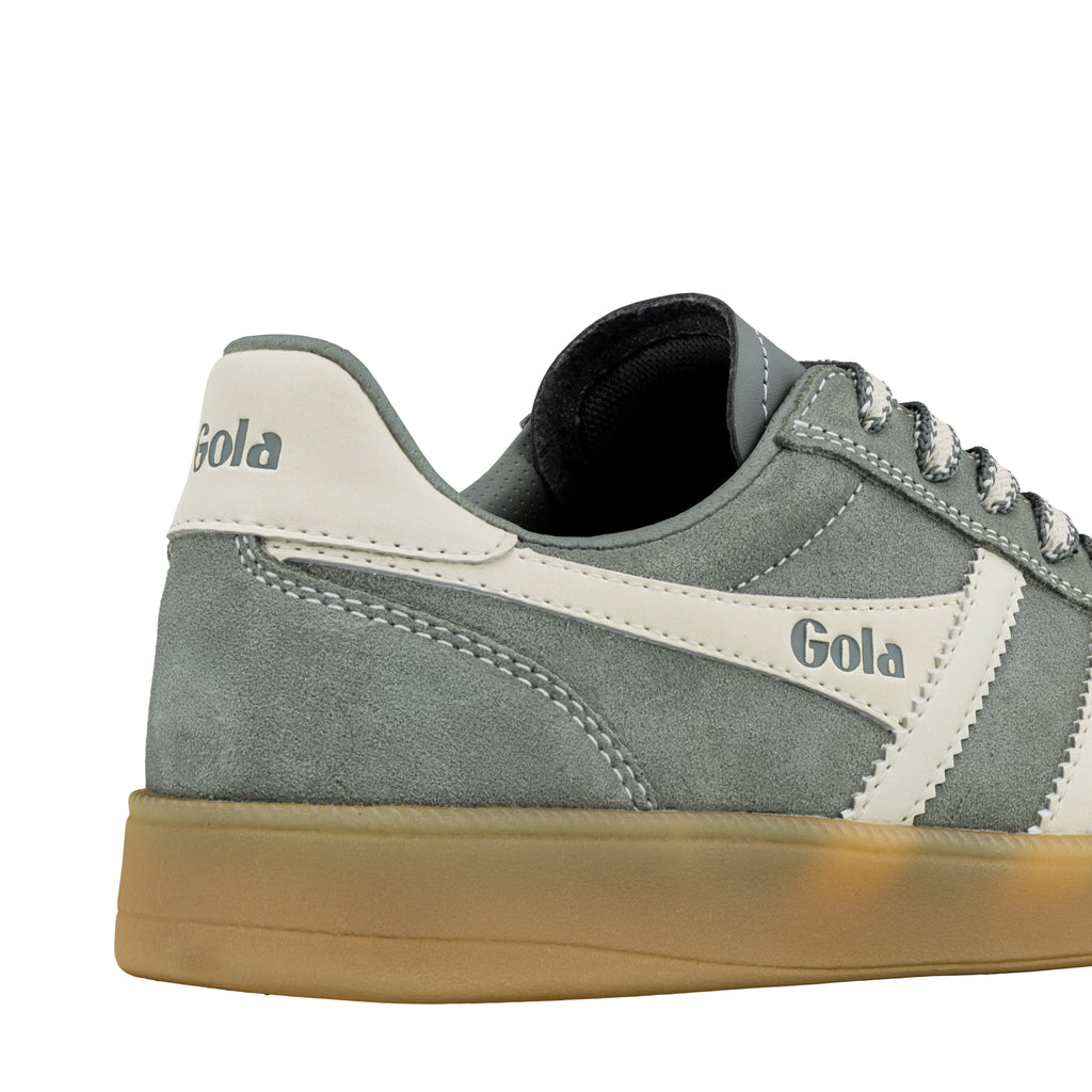 Close up of the heel and side of a grey suede Gola trainer with a gum sole