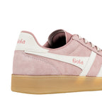 Close up of a pink suede Gola trainer with white side panels and a gum sole
