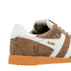 Close up of a brown snakeskin pattern Gola trainer with white trim and a gum sole