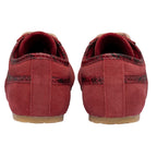 Pair of red suede trainers with snakeskin trim, rear view