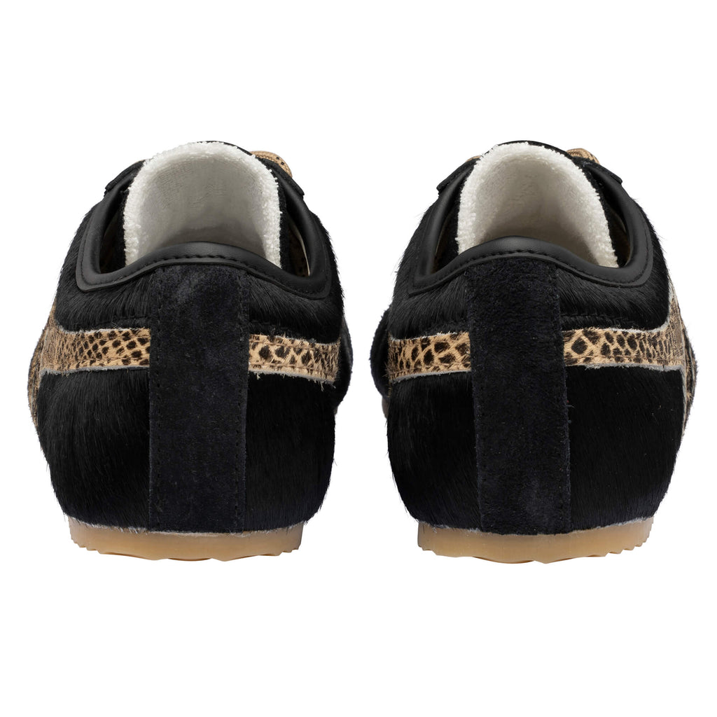 Pair of black pony hair trainers with leopard print stripe, rear view