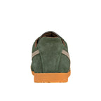 Rear view of a green suede trainer with a gum rubber sole