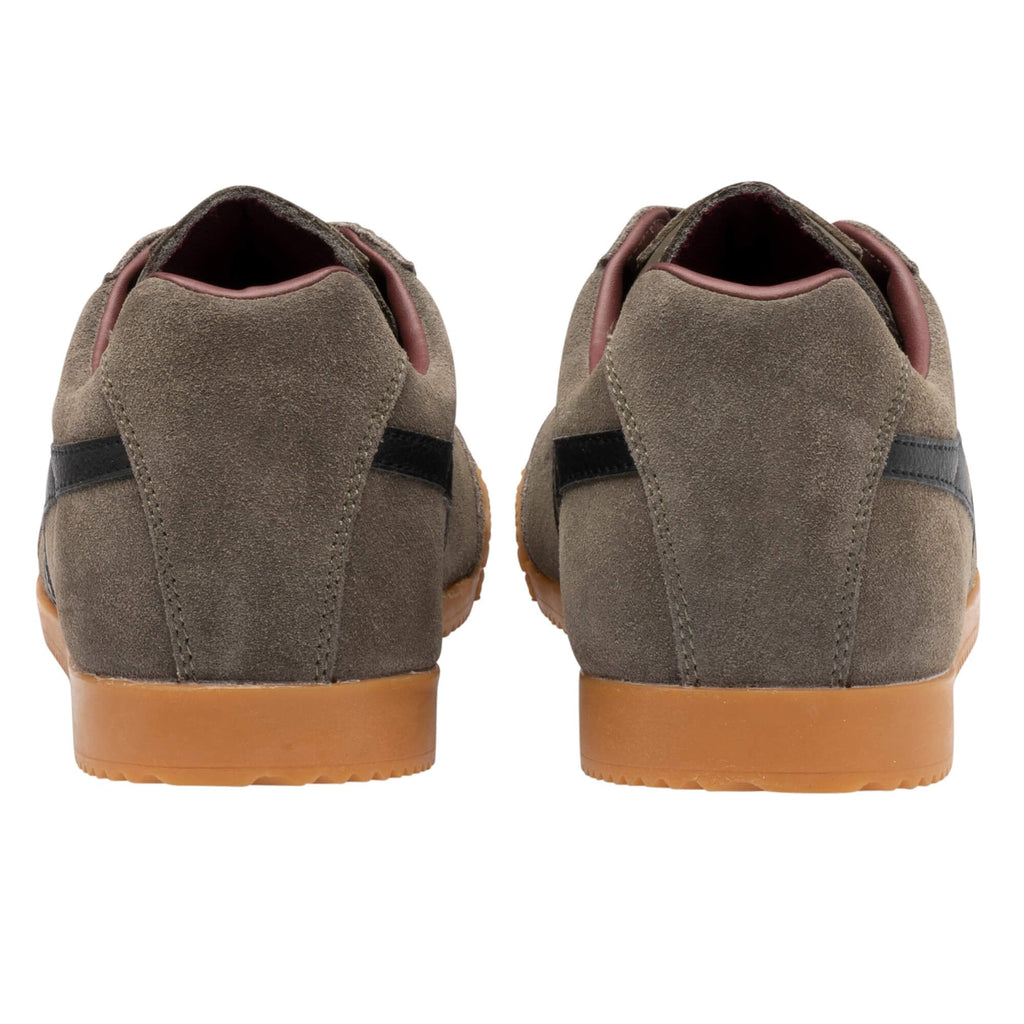 Rear view of olive suede trainers with black side stripes and gum rubber soles