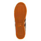 Orange rubber trainer sole with chevron tread pattern and Gola logo