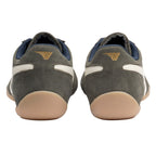 Rear view of grey suede trainers with white side stripes and gum rubber soles