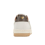 Rear view of a white and brown trainer with a gold logo on the heel