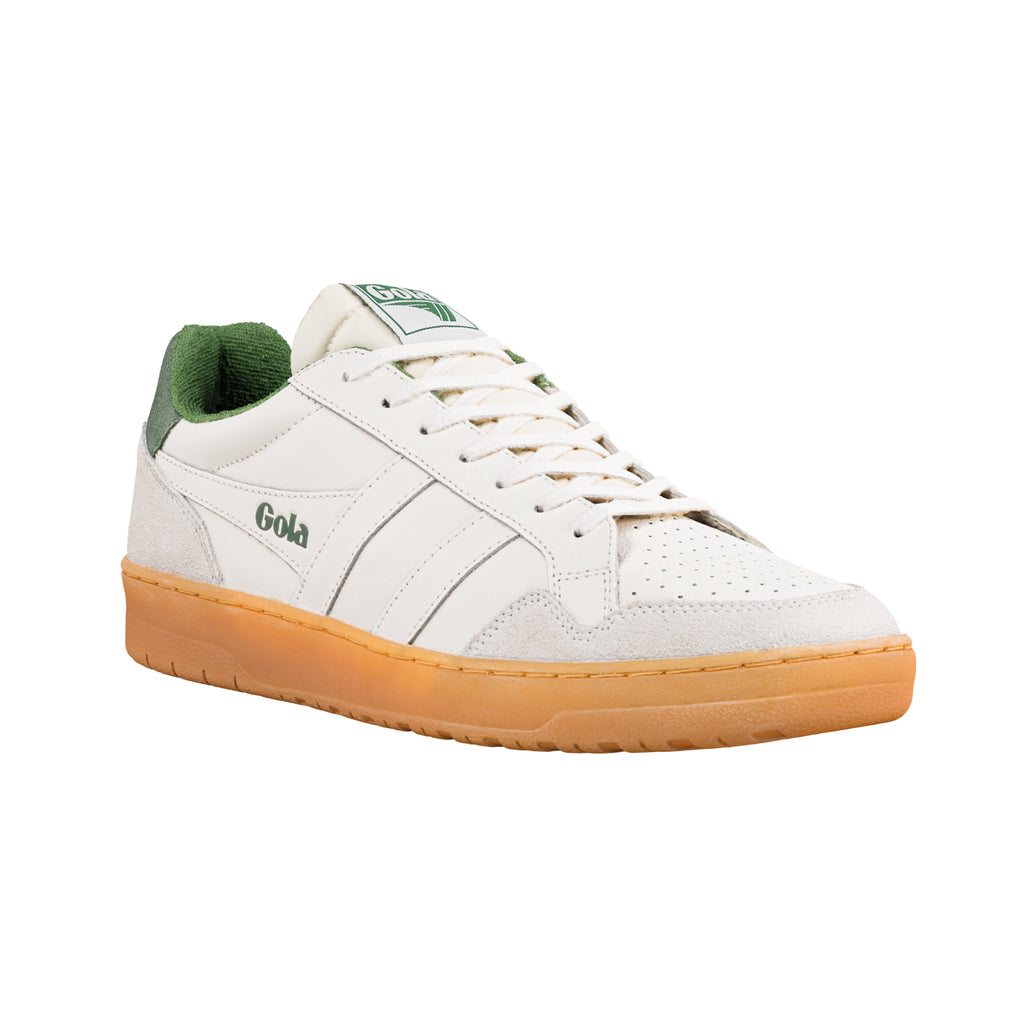 White Gola trainer with green trim and a gum sole
