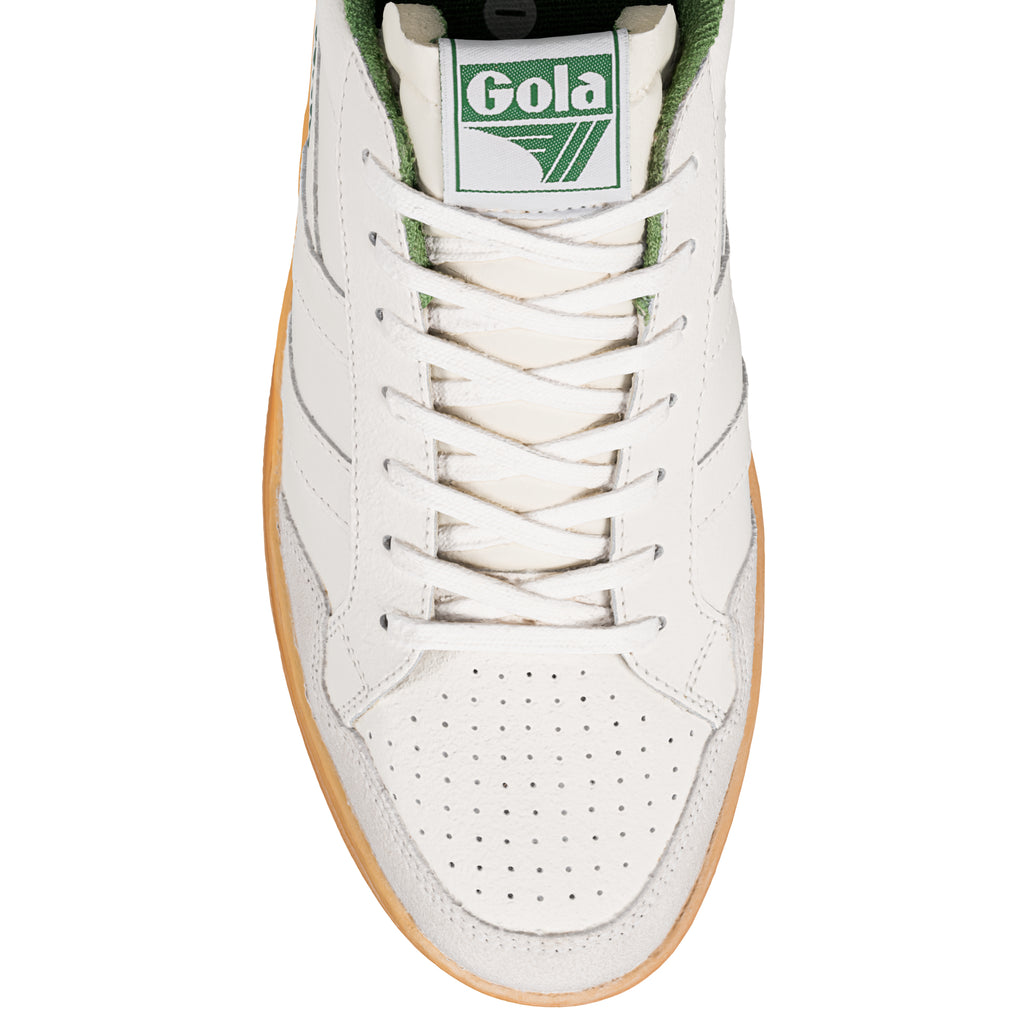 Close up of the front of a white Gola trainer with green trim and white laces