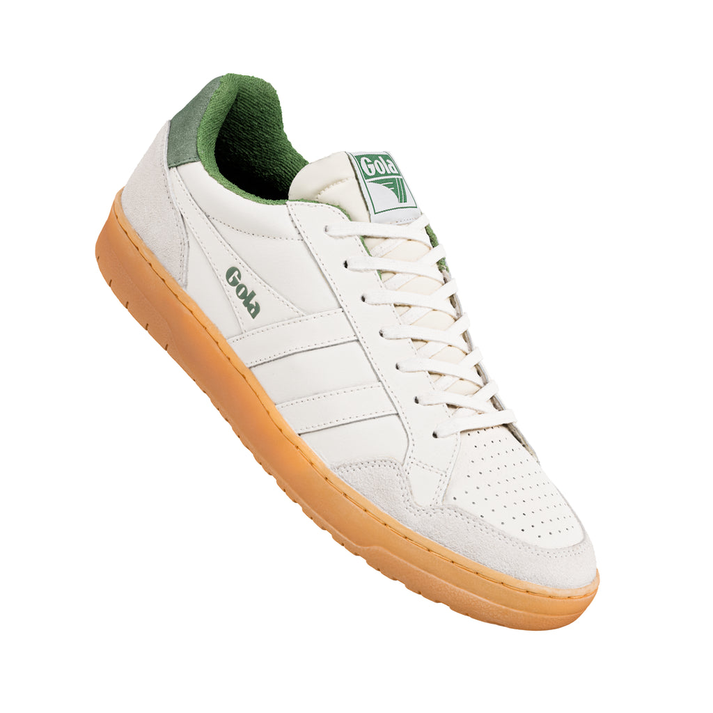 White Gola trainer with green lining and gum sole