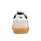 Rear view of a white and green trainer with a gum sole